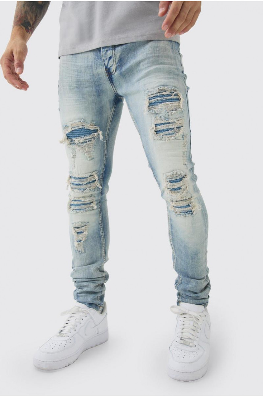 Супервузькі стрейч-блідо-блакитні байкерські джинси з рваними і відновленими накладками