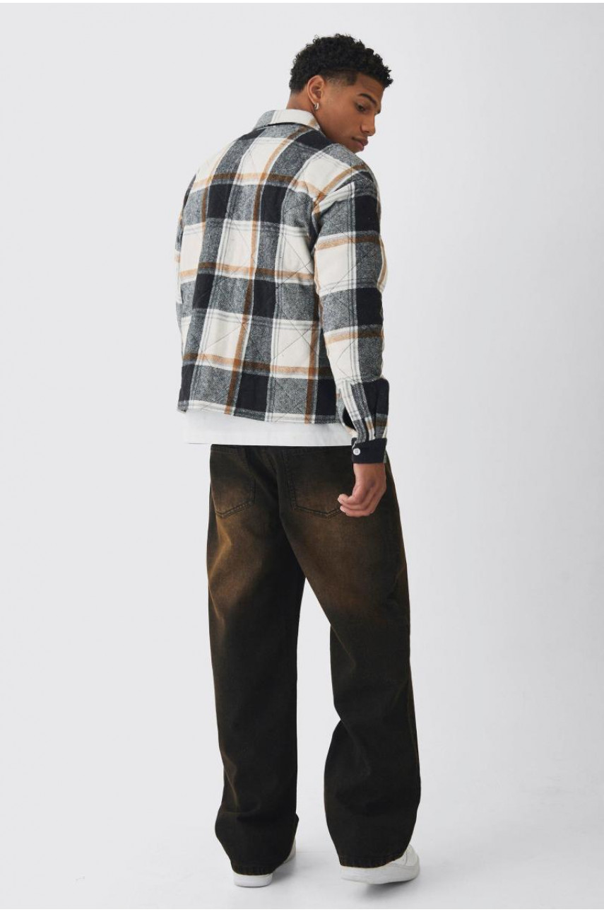 Розслаблені жорсткі коричневі витерті джинси