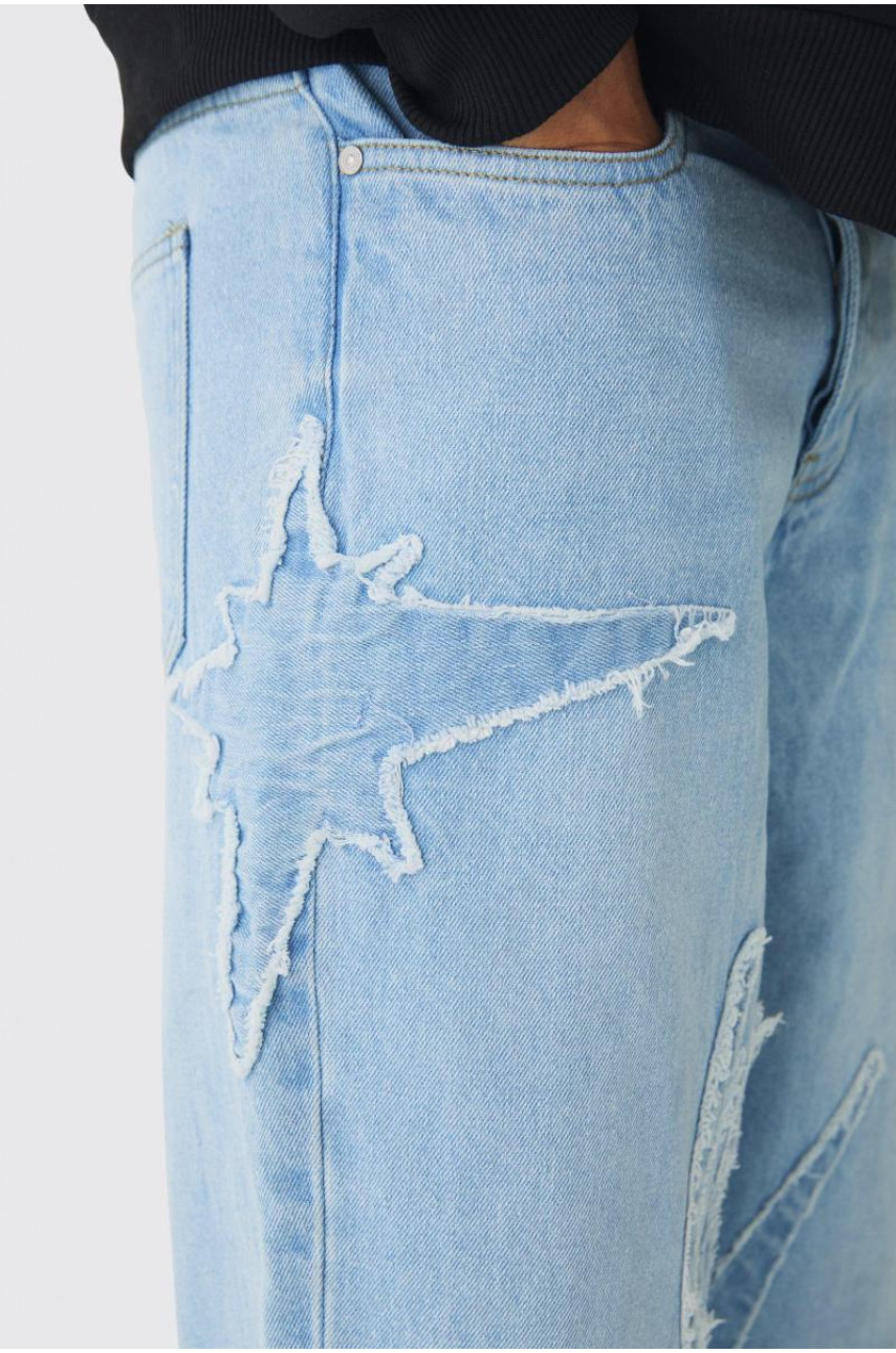 Мішкуваті жорсткі джинси з необробленими краями з аплікацією