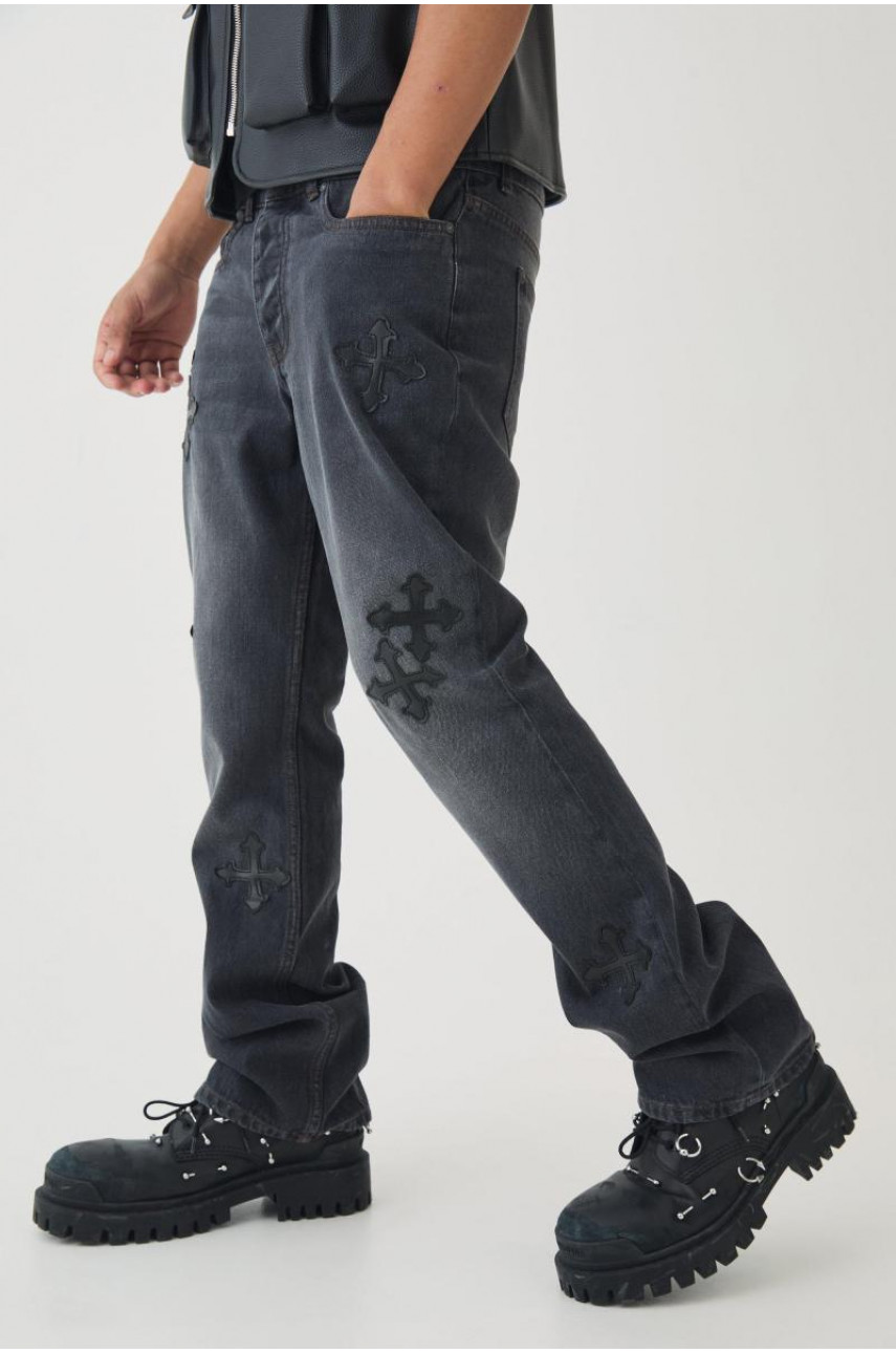 Вузькі жорсткі кльошові джинси з вишивкою хрестом