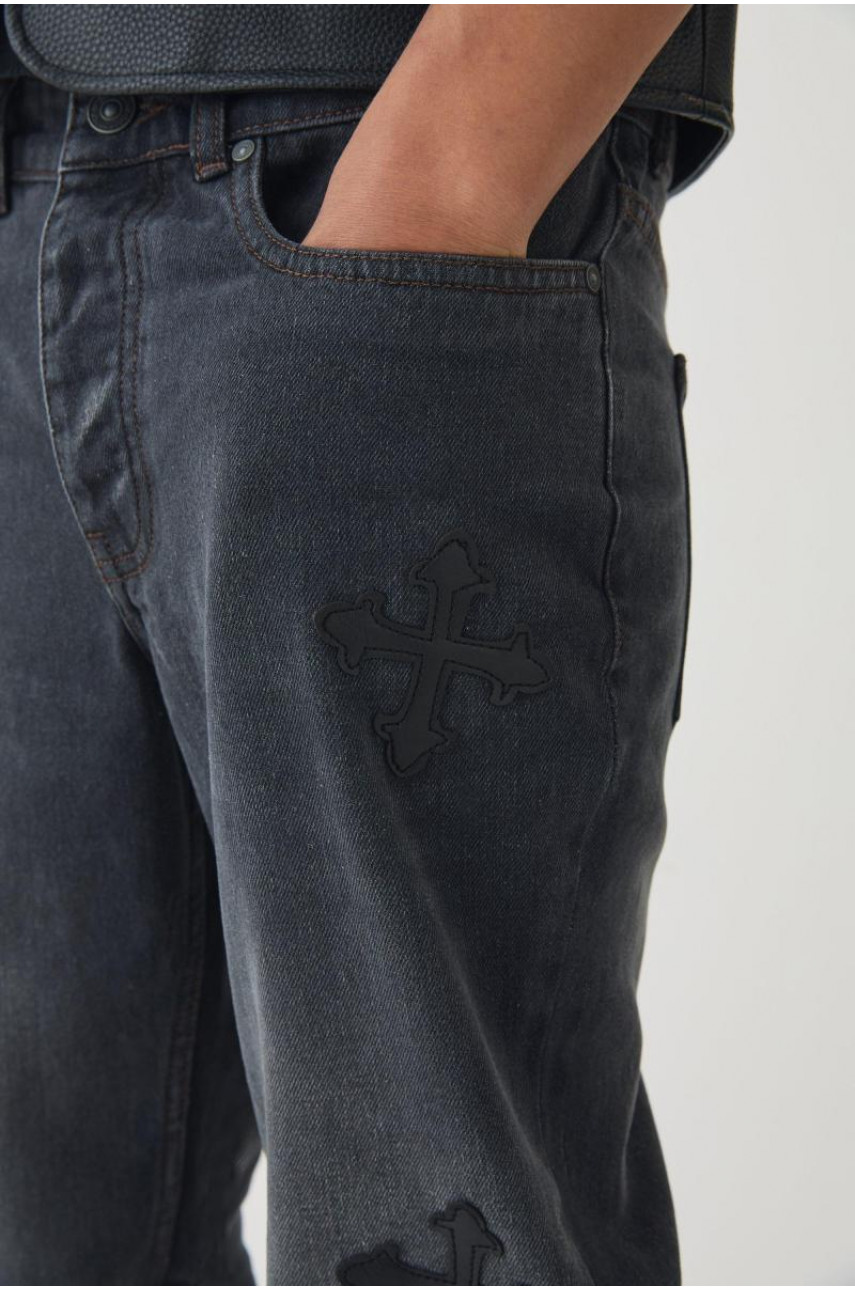 Вузькі жорсткі кльошові джинси з вишивкою хрестом