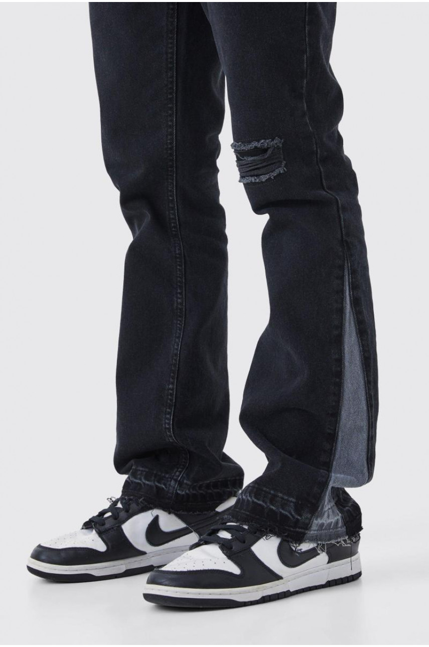 Тонкі жорсткі розкльошені контрастні рвані джинси з ластовицею